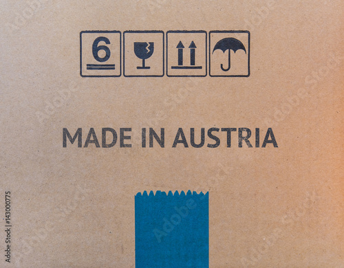 MADE IN AUSTRIA written on brown cardboard box.