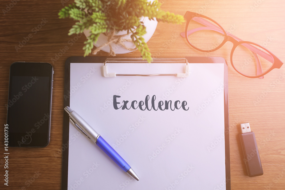 Fototapeta premium Business concept - Top view notebook writing Excellence.