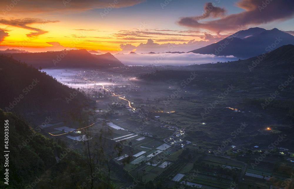Trio Mountains of Bali (Mt Batur, Mt Abang, Mt Agung) and view village in Kintamani, Bali, Indonesia with beautiful morning sunrise
