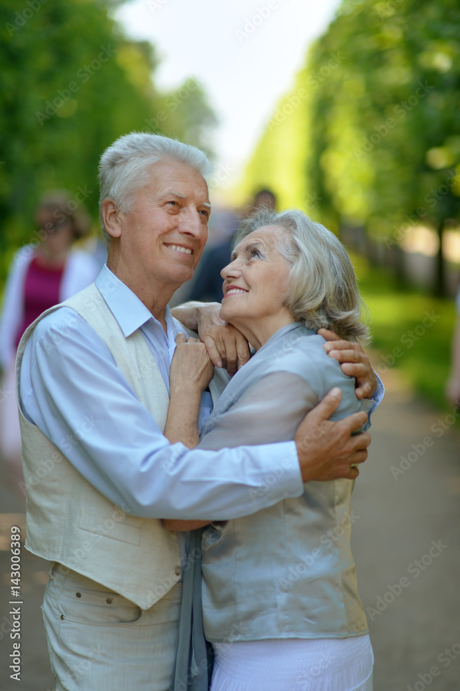 Happy elderly couple embracing