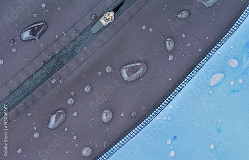 Detailed view of  softshell jacket with water drops, zipper and seams. photo
