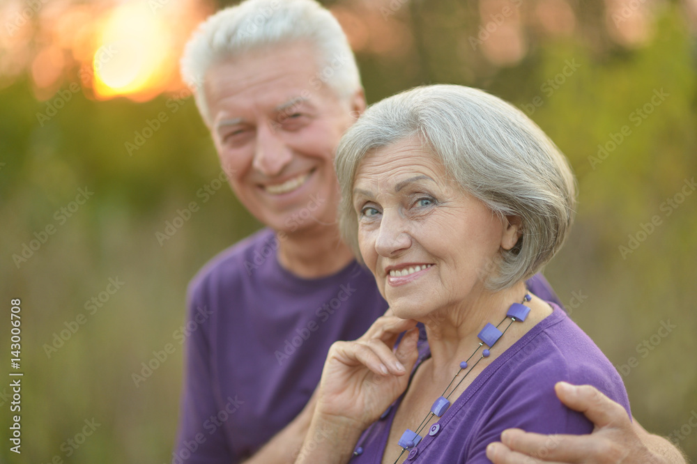 Happy elderly couple embracing