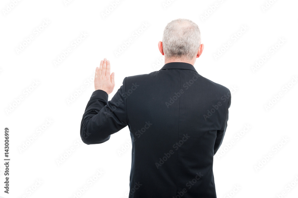 Back view aged elegant man making oath gesture Back view aged elegant man making oath gesture