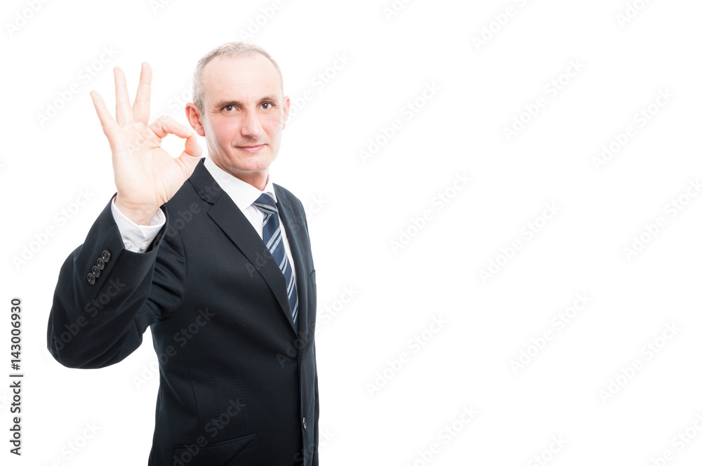 Portrait of aged elegant man showing okay gesture Portrait of aged elegant man showing okay gesture