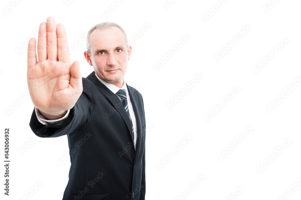 Portrait of aged elegant man showing stop gesture Portrait of aged elegant man showing stop gesture