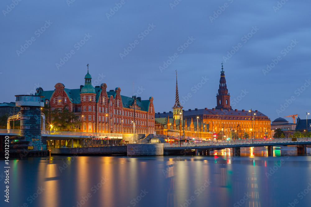 Night view on Christiansborg Palace and Slotsholmen over the canal in Copenhagen, Denmark.