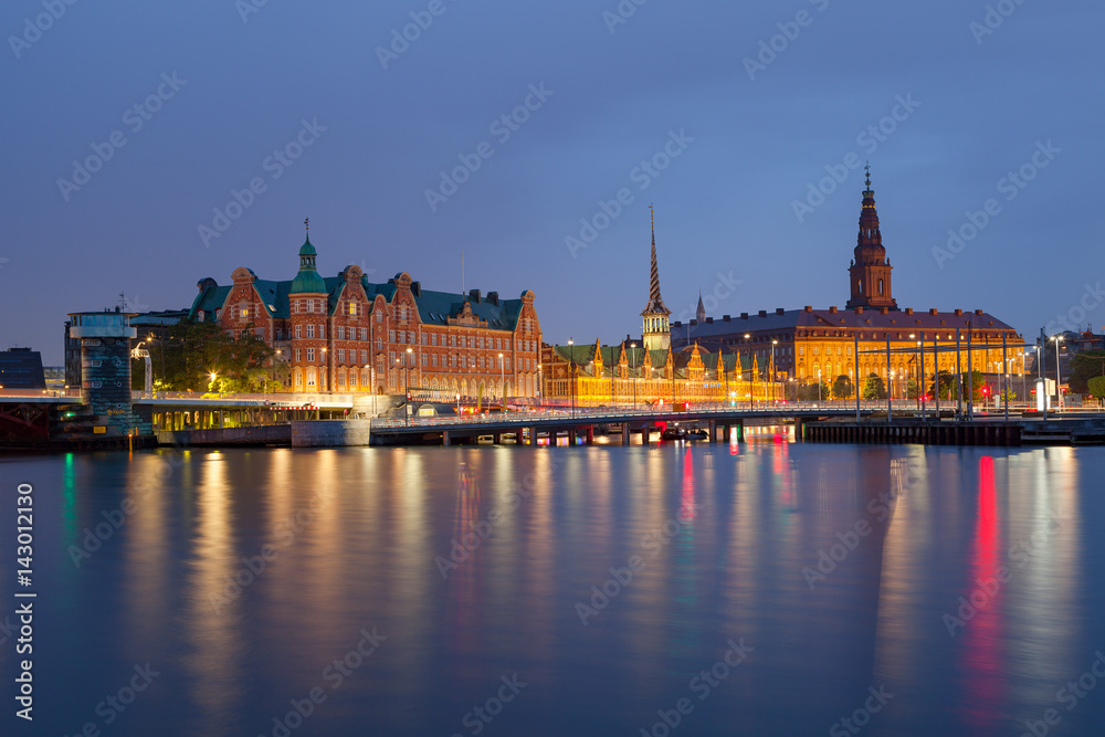 Night view on Christiansborg Palace and Slotsholmen over the canal in Copenhagen, Denmark. Night view on Christiansborg Palace and Slotsholmen over the canal in Copenhagen, Denmark.