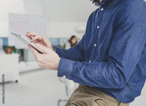 Unrecognizable Businessman Using Tablet