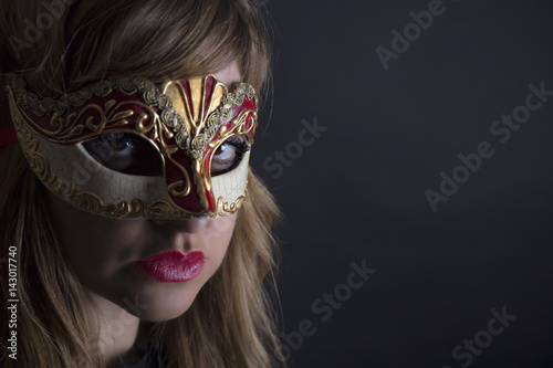 Beautiful girl with venetian carnival mask