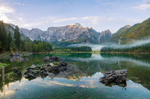 Fototapeta Naklejka Na Ścianę i Meble -  Dawn over the alpine lake Laghi di fusine in the julian alps in italy,High resolution photo