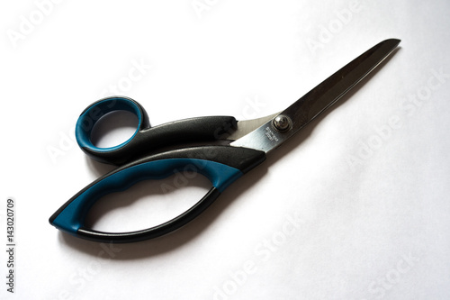 Stainless steel tailor scissors with black and blue plastic handle