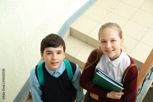 Cute boy and girl in school...