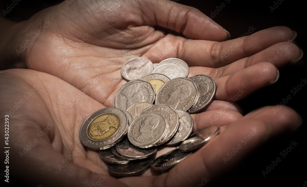 Closeup of Woman hand's holding Thai coins Closeup of Woman hand's holding Thai coins