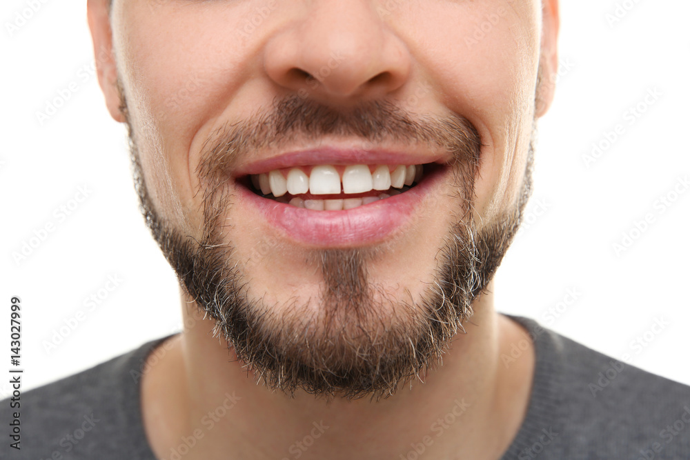 Smiling young man on white background, closeup Smiling young man on white background, closeup