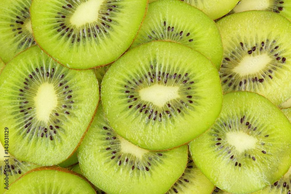 slices of fresh green kiwi fruits food background texture slices of fresh green kiwi fruits food background texture