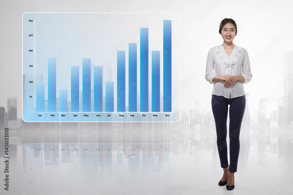 Young asian business woman showing growing financial graph Young asian business woman showing growing financial graph