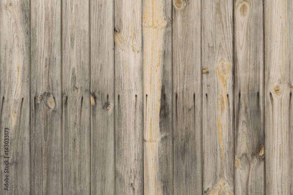 Old wooden vertical pine planks wall with rusty nails background texture.