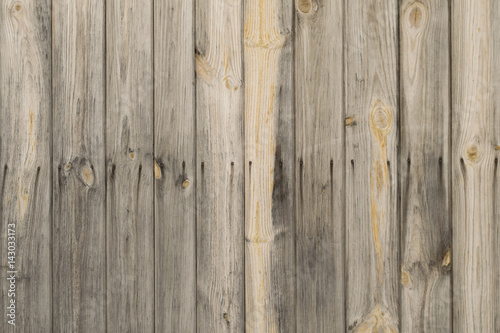 Old wooden vertical pine planks wall with rusty nails background texture.