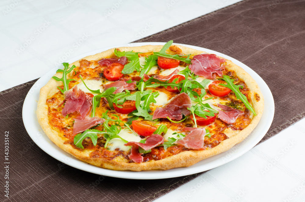 Tasty Italian Pizza With Prosciutto, Fresh Tomatoes And Arugula Tasty Italian Pizza With Prosciutto, Fresh Tomatoes And Arugula