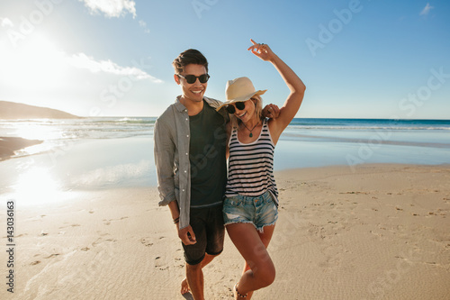 Young couple in love enjoying on the beach
