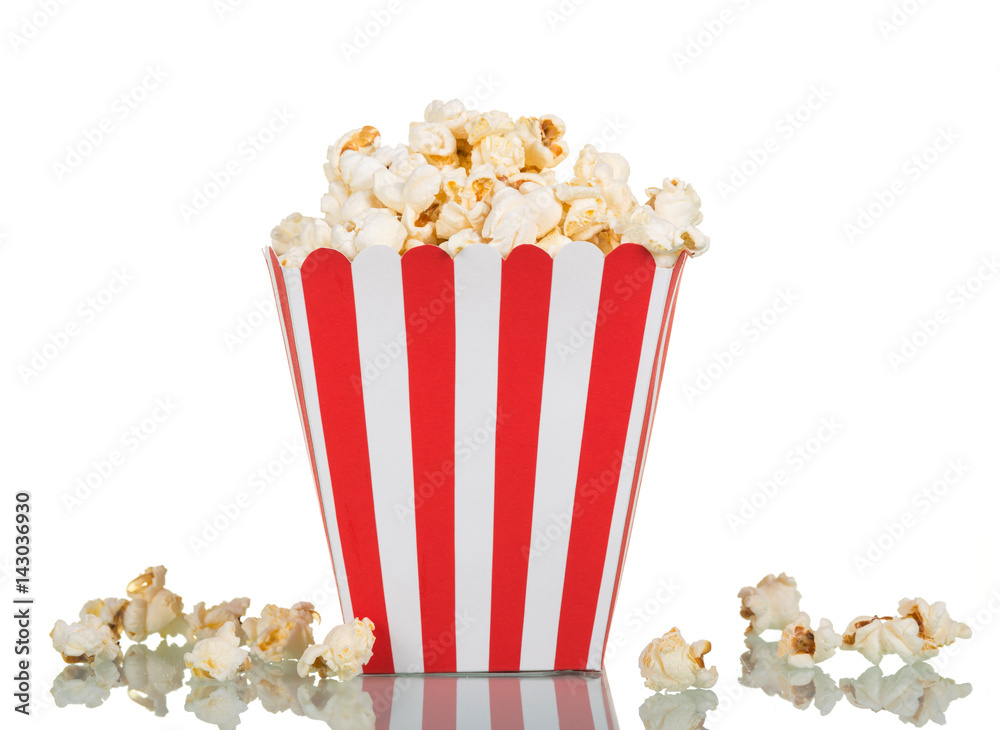 Popcorn in large square box and near isolated on white. Popcorn in large square box and near isolated on white.