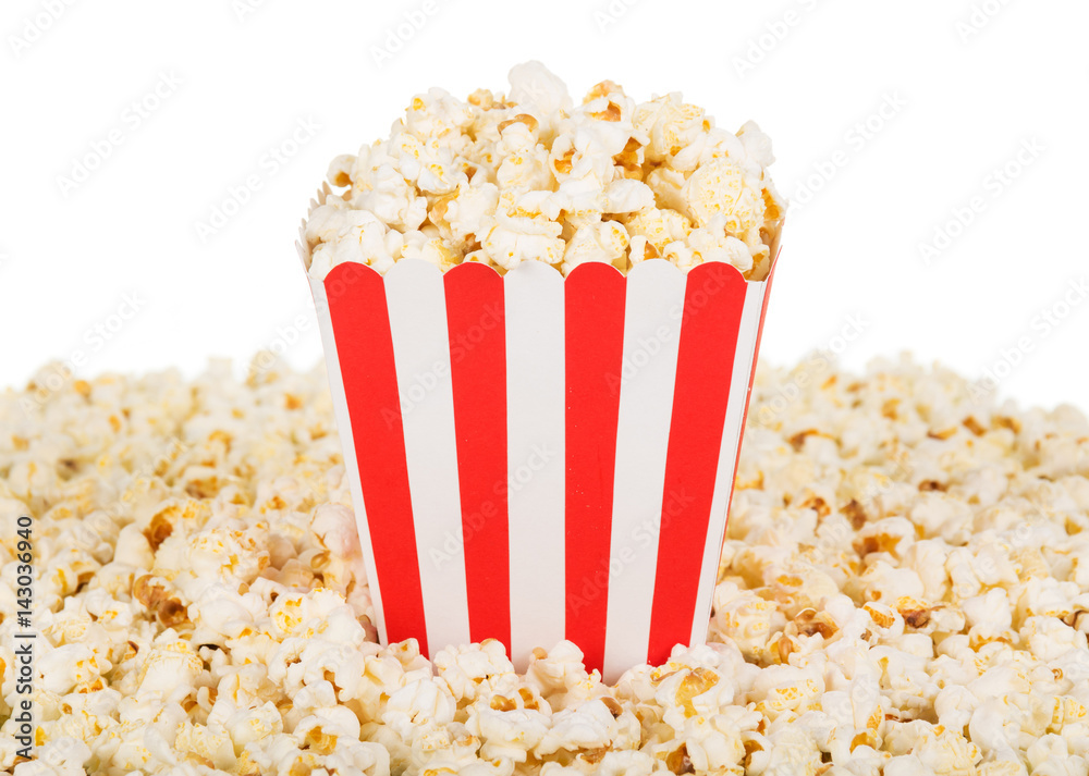 Large square box popcorn and are many around, isolated on white.