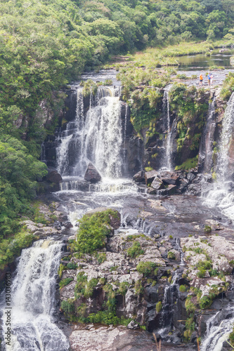 People over Canyon waterfall