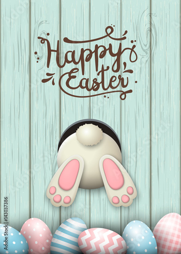 Easter motive, bunny bottom and easter eggs in fresh grass on blue wooden background, illustration