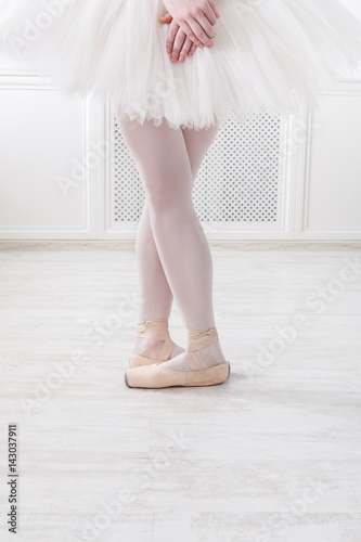 Ballerina legs closeup in fifth position