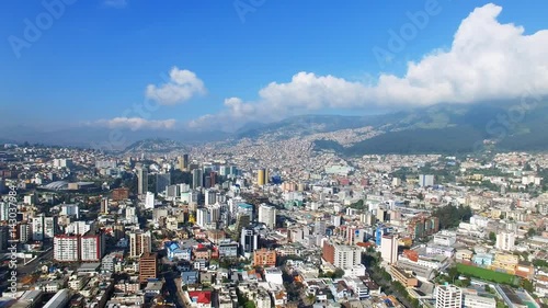 Aerial view of cityscape of Quito, modern capital city of Ecuador from above, Andes mountains on background