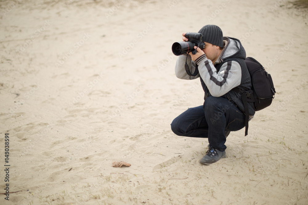 Photographers work with a model on the street