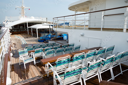row of sun chairs  on the ship deck