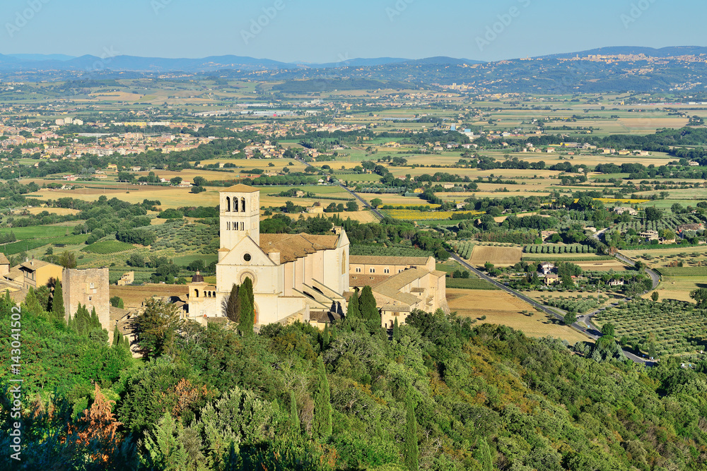 Panoramic view of the historic town of Assisi and Basilica of St. Francis. Valley of Tescio, Assisi, Umbria Region, Perugia Metropolitan, Italy.