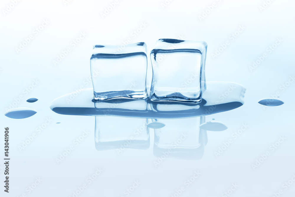 Melting ice cubes with reflection isolated on white.