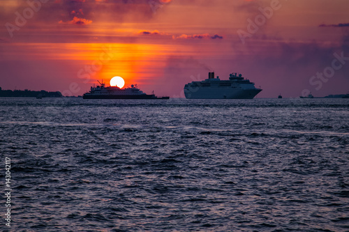 Cruise liner swimming on ocean at sunset © Ivan Kurmyshov