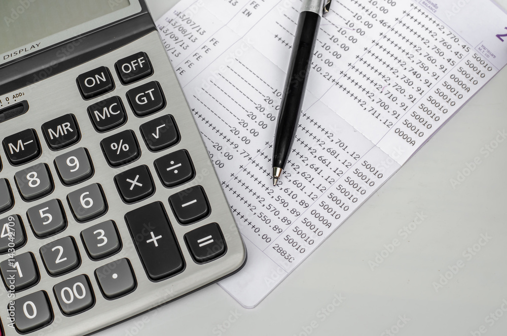Bank account passbook with pen and calculator Bank account passbook with pen and calculator
