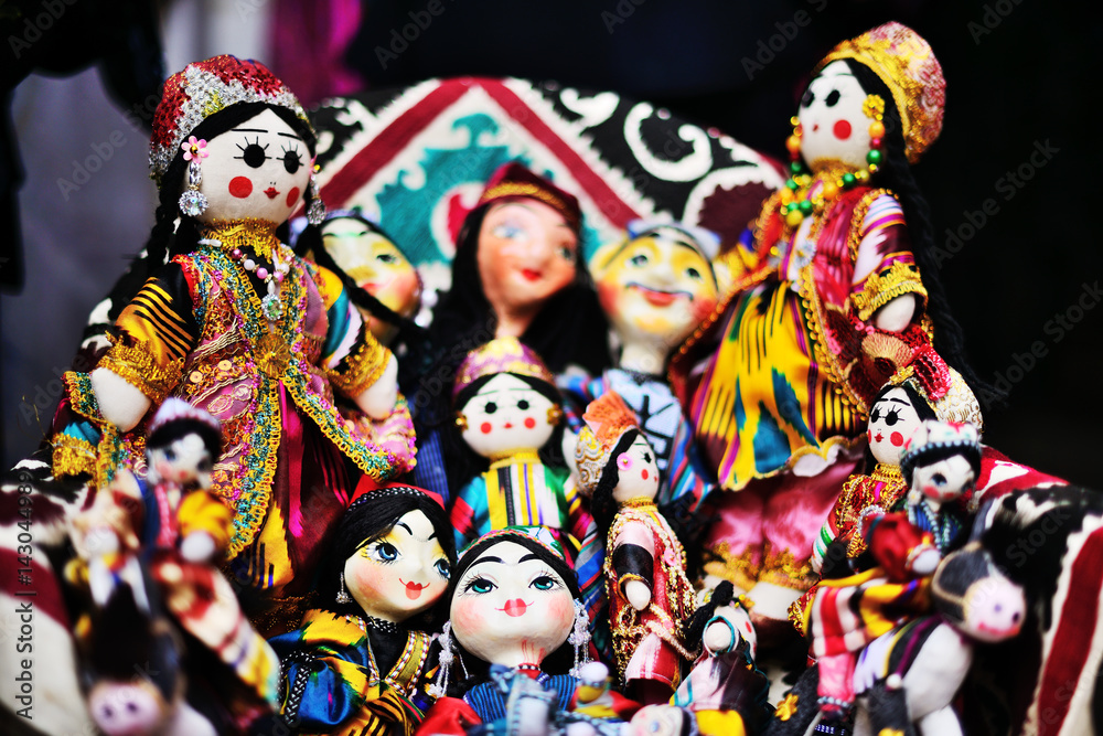Traditional souvenir painted mashed paper (papier mache) dolls dressed in traditional costumes. Itchan Kala (Xiva Ichon Qala) UNESCO world heritage, Khiva, Uzbekistan.