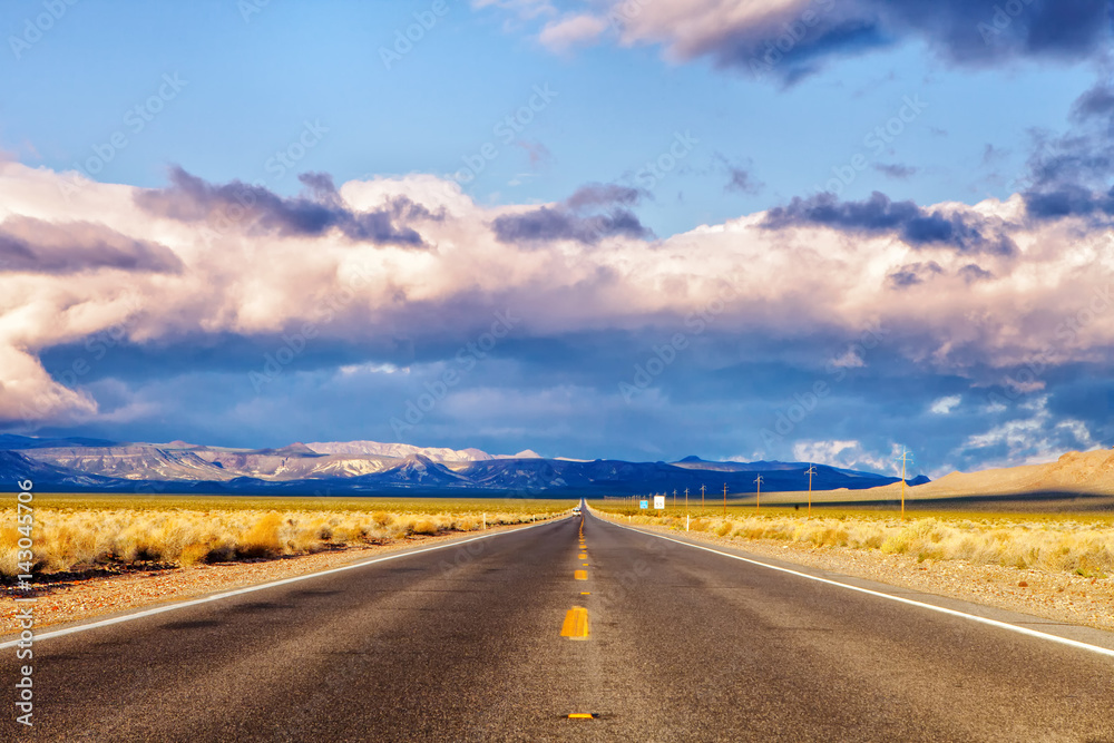 road leading to the death valley national park in Nevada in the United States in the morning during sunrise road leading to the death valley national park in Nevada in the United States in the morning during sunrise