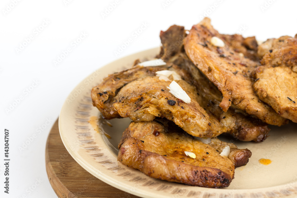 Fried pork chops served on the plate isolated over white background Fried pork chops served on the plate isolated over white background