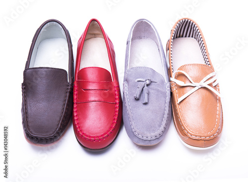Teen red moccasins on a white background