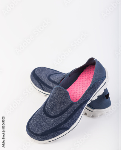 Blue trendy sport shoes on white background