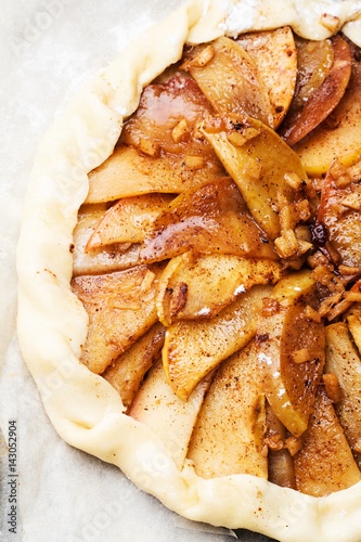 Biscuits with apples, cinnamon and ginger before baking close-ups. photo