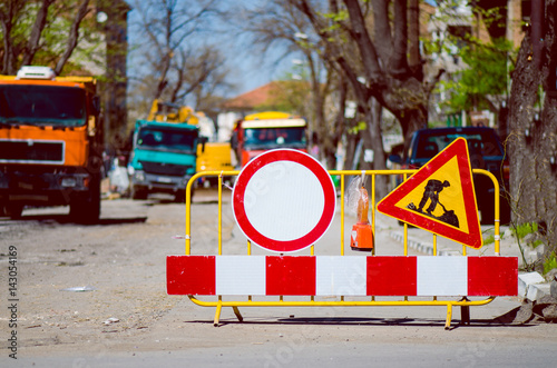 Forbidden Passing Sign Due To Street Renovation With Blurred Trucks Behind