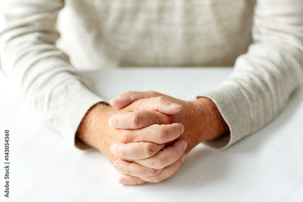 close up of senior man hands on table close up of senior man hands on table
