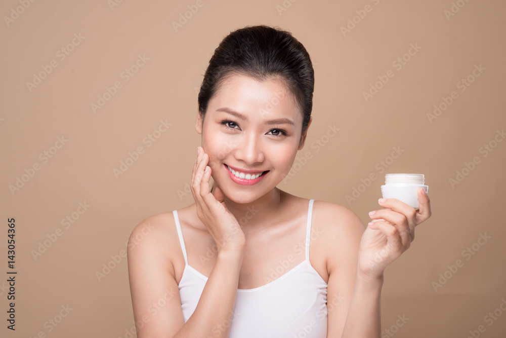 Skincare. Beautiful asian woman show moisturizer or lotion product. Skincare. Beautiful asian woman show moisturizer or lotion product.