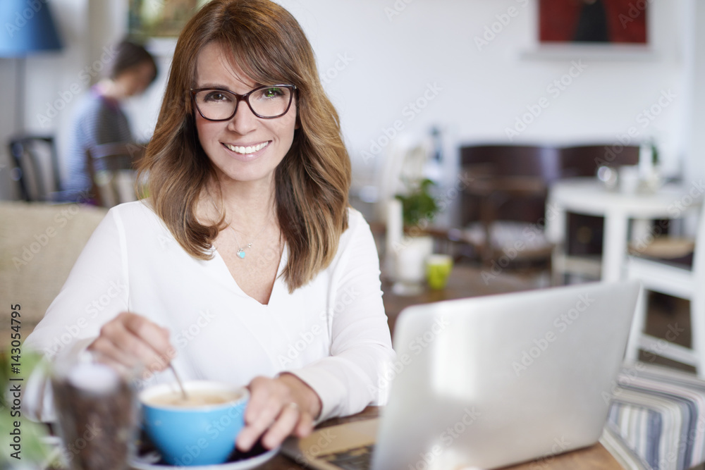 Enjoy my morning latte in coffee shop. Shot of an attractive female using laptop while sitting in cafe and working online. Small business. Enjoy my morning latte in coffee shop. Shot of an attractive female using laptop while sitting in cafe and working online. Small business.