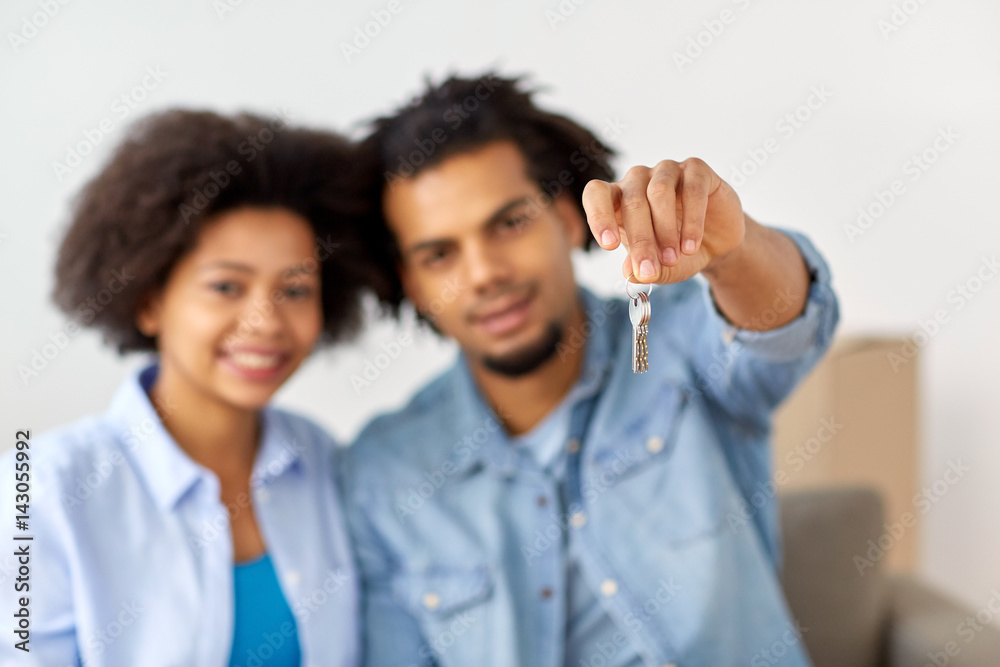 happy couple with key and boxes moving to new home happy couple with key and boxes moving to new home