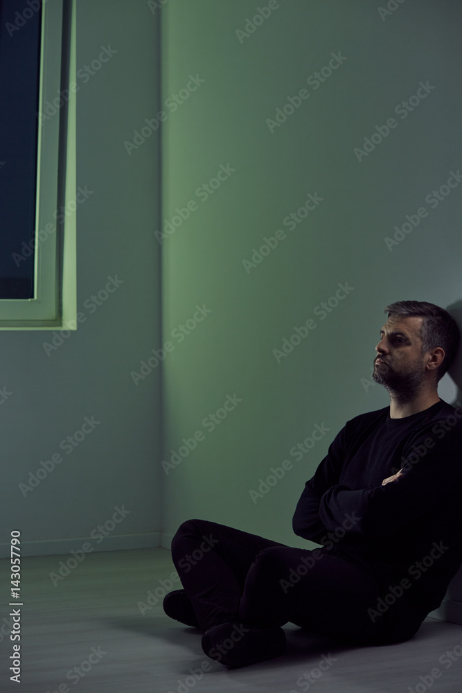 Man sitting in empty room