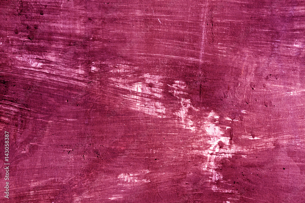 Weathered pink cament wall surface.