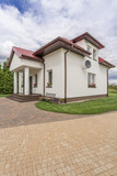 Porches villa with cobblestone driveway idea